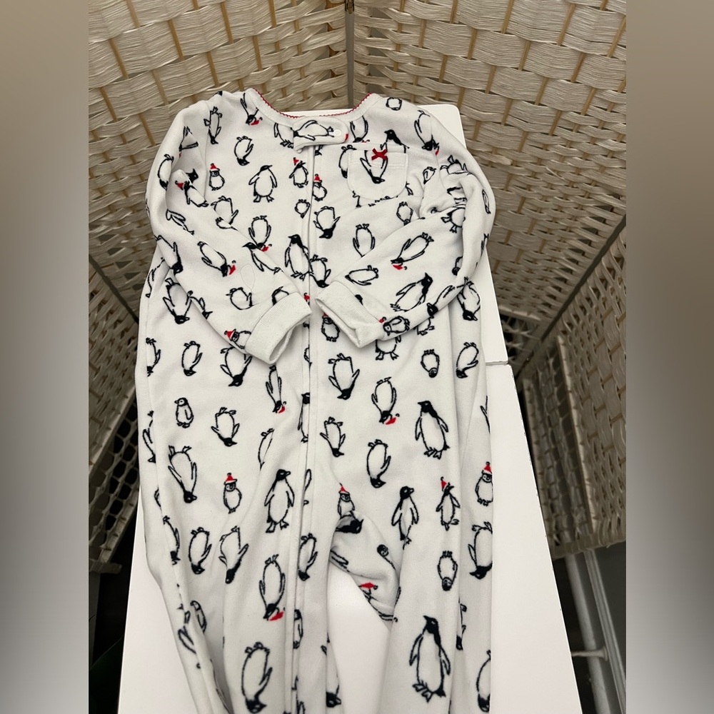 Two pairs of Carters footed fleece pjs